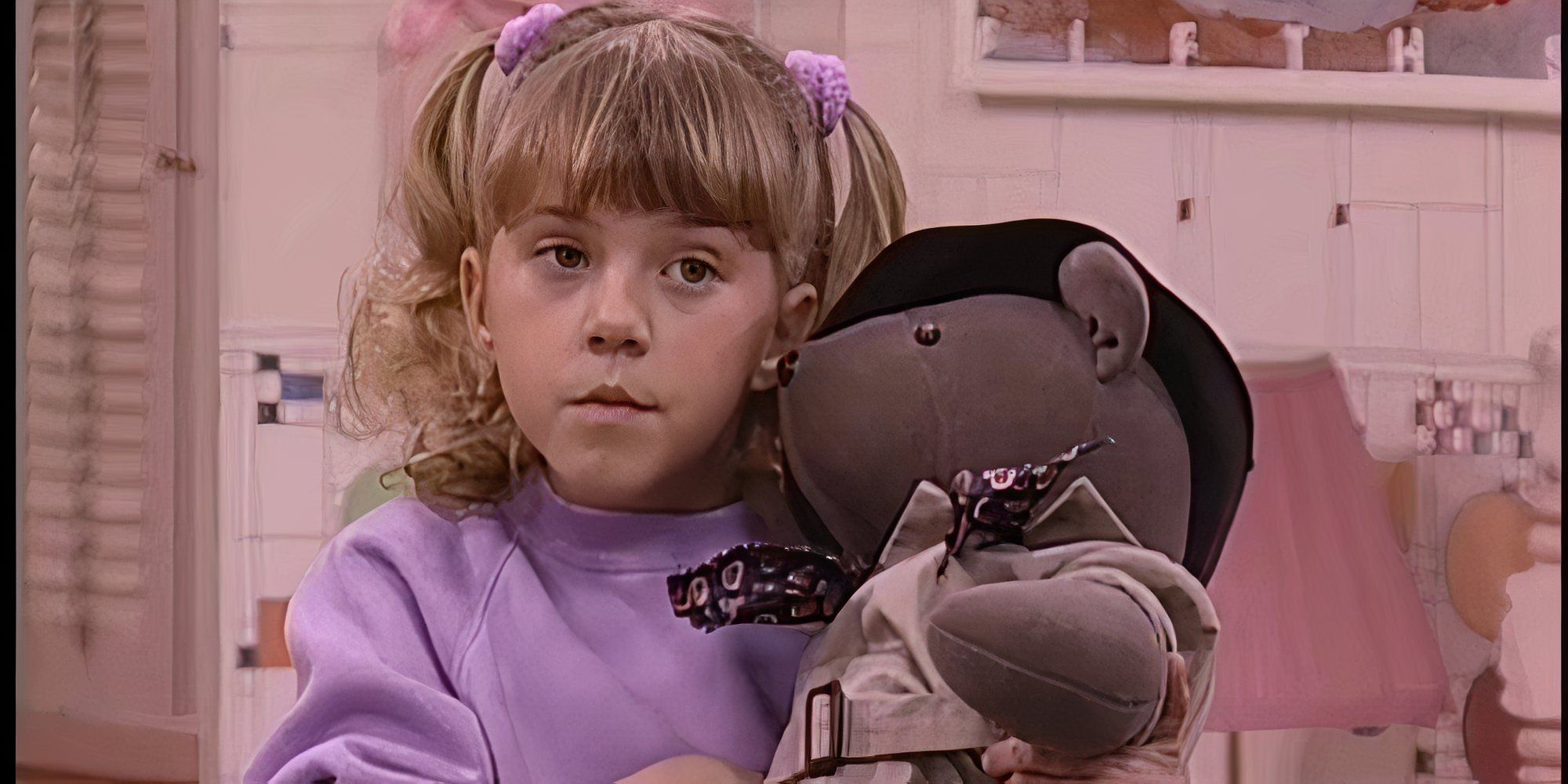 Stephanie is hugging her beloved Mr. Bear stuffed toy.