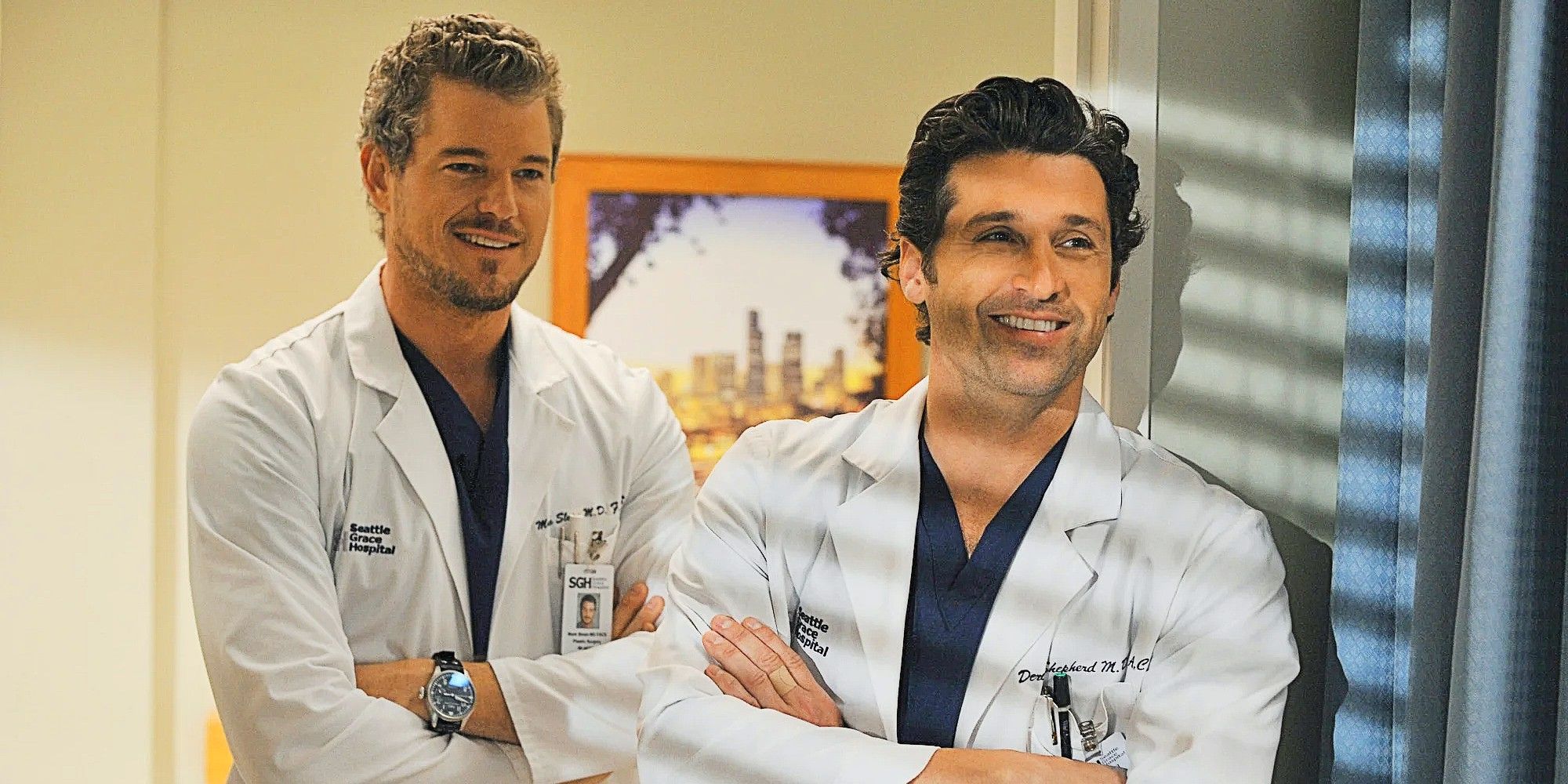 Mark Sloan and Derek Shepherd standing together and smiling in Grey's Anatomy.