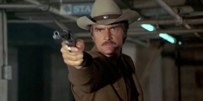 Sam McCloud (Dennis Weaver) draws his weapon on 'McCloud.'