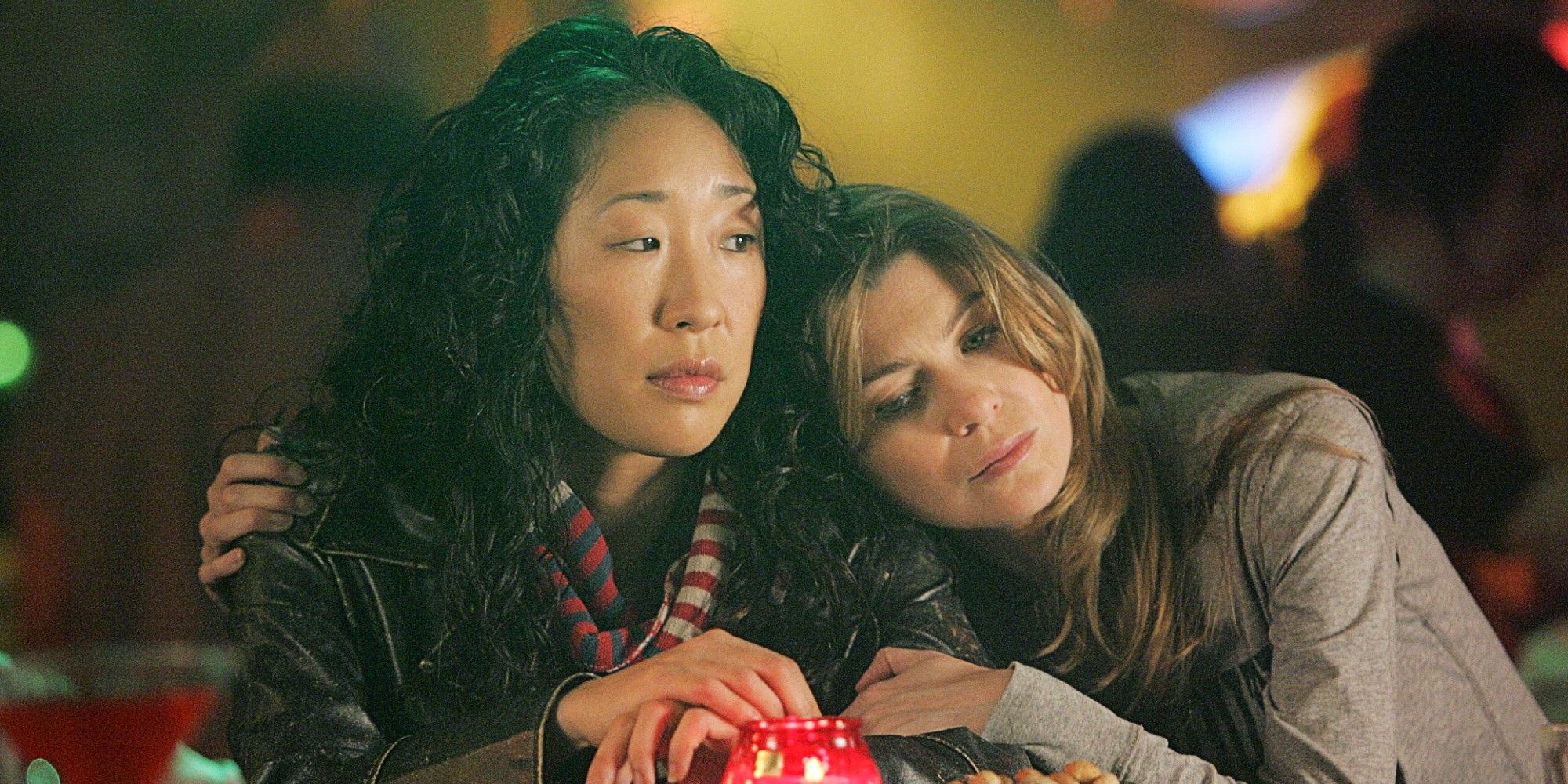 Meredith and Cristina hugging in Grey's Anatomy.