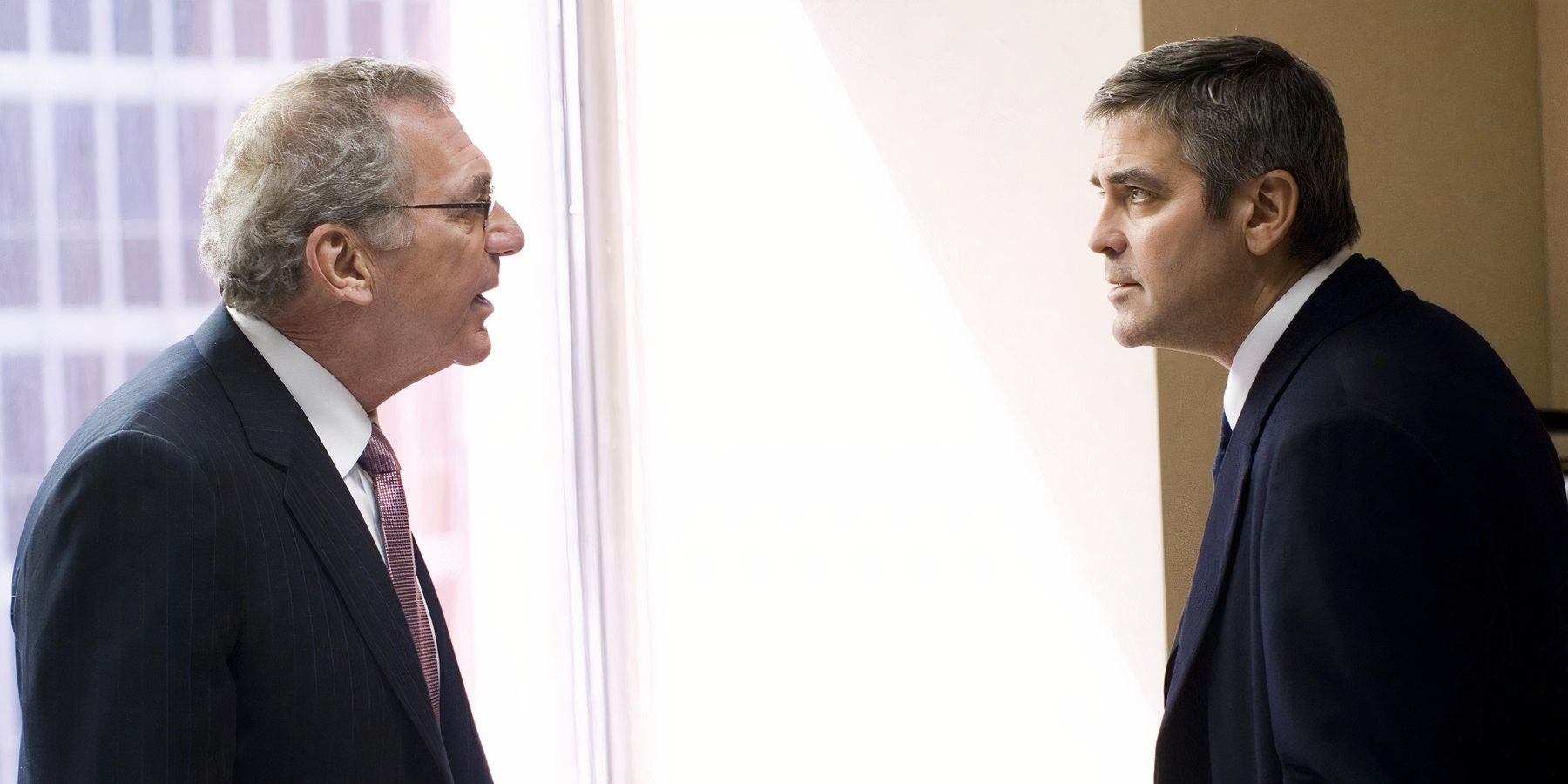 George Clooney as Michael Clayton and Sydney Pollack as Marty Bach in Michael Clayton (2007).