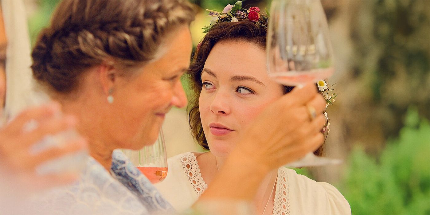A woman looking to the side at a party in Midsummer Night