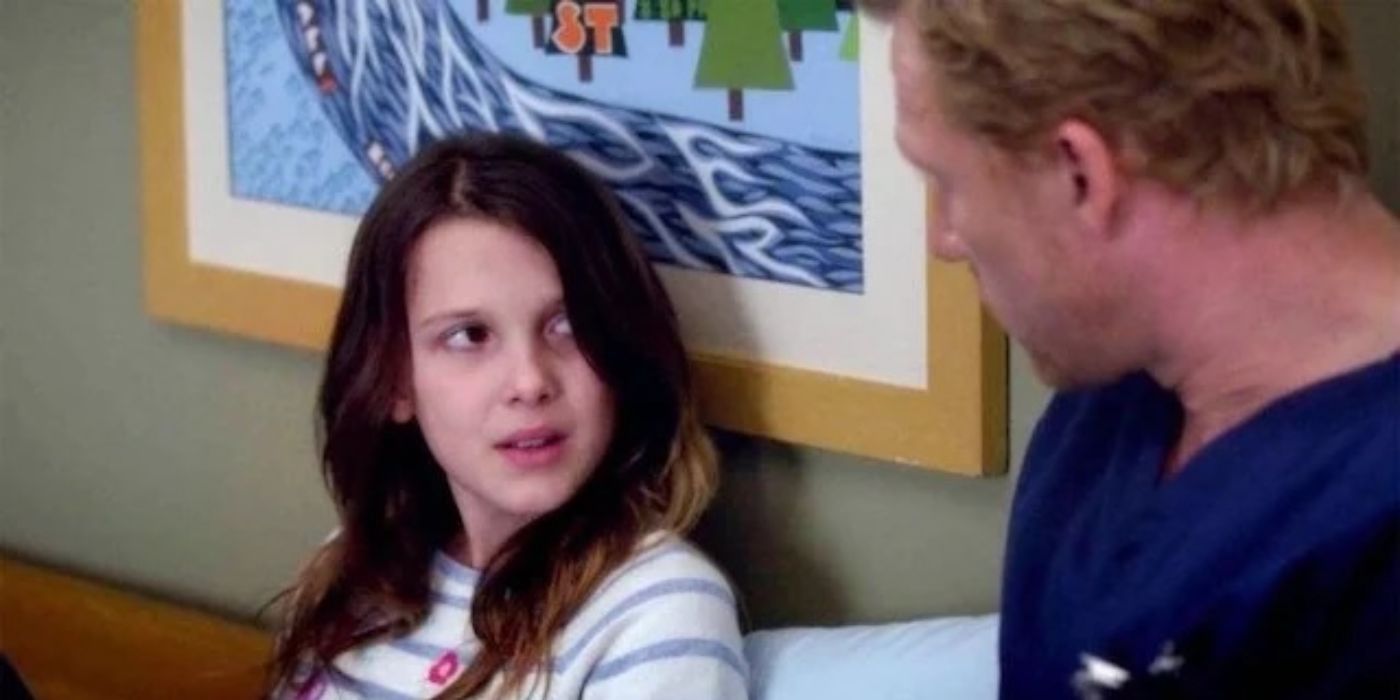 A young Millie Bobby Brown as Ruby looks sad and talks to Kevin McKidd as Dr. Owen Hunt in Grey's Anatomy.