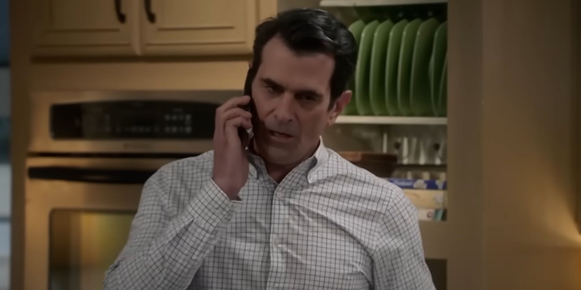 Phil (Ty Burrell) on the phone in Modern Family