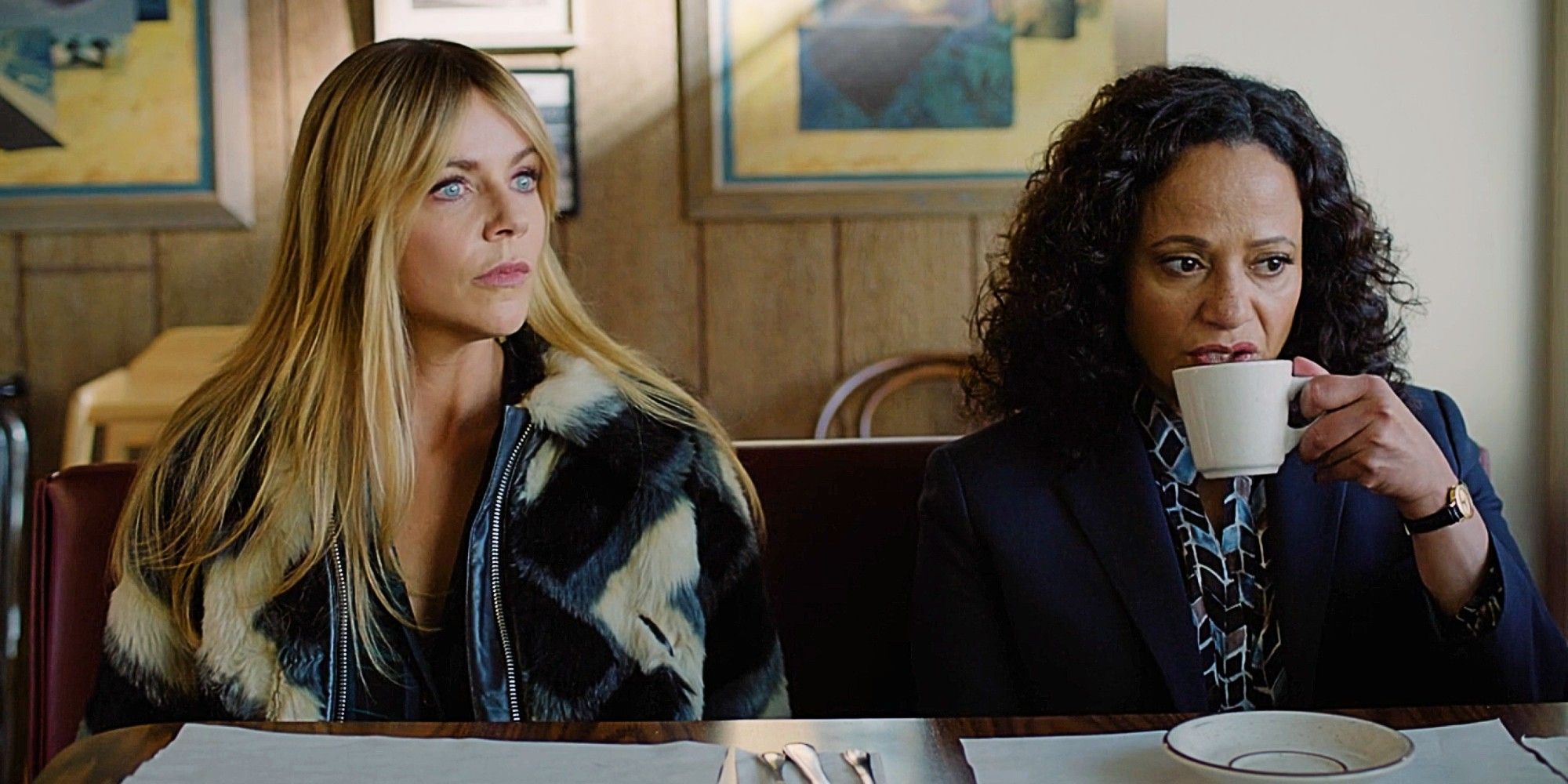 Morgan Gillory and Selena Soto sitting next to each other at a diner in High Potential Season 1 Episode 9.