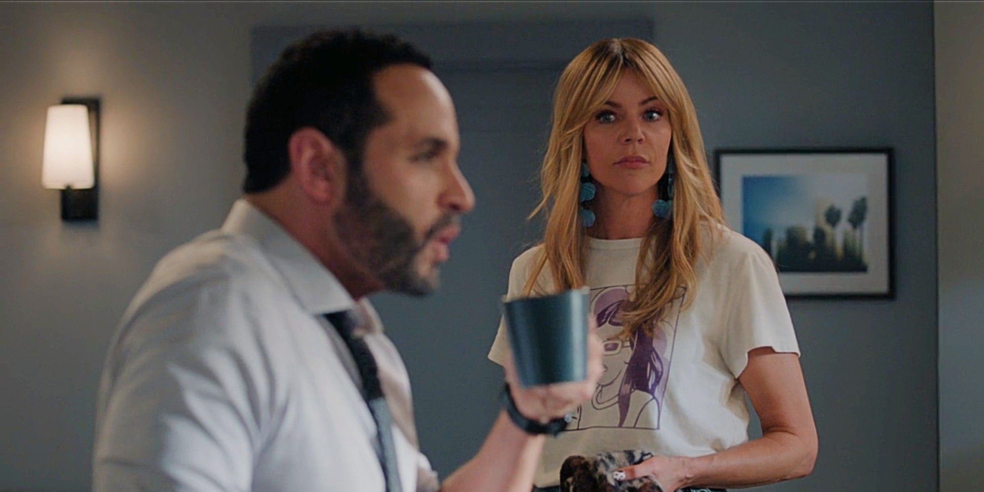 Karadec drinking coffee as Morgan stands behind him in High Potential Season 1 Episode 8