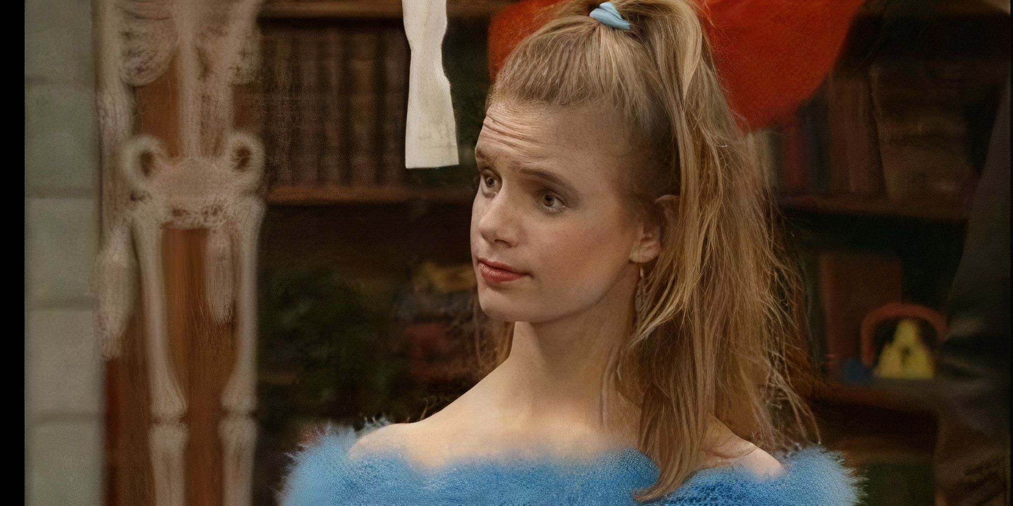 Kimmy Gibbler is looking confused in her birthday dress at the Tanner house.