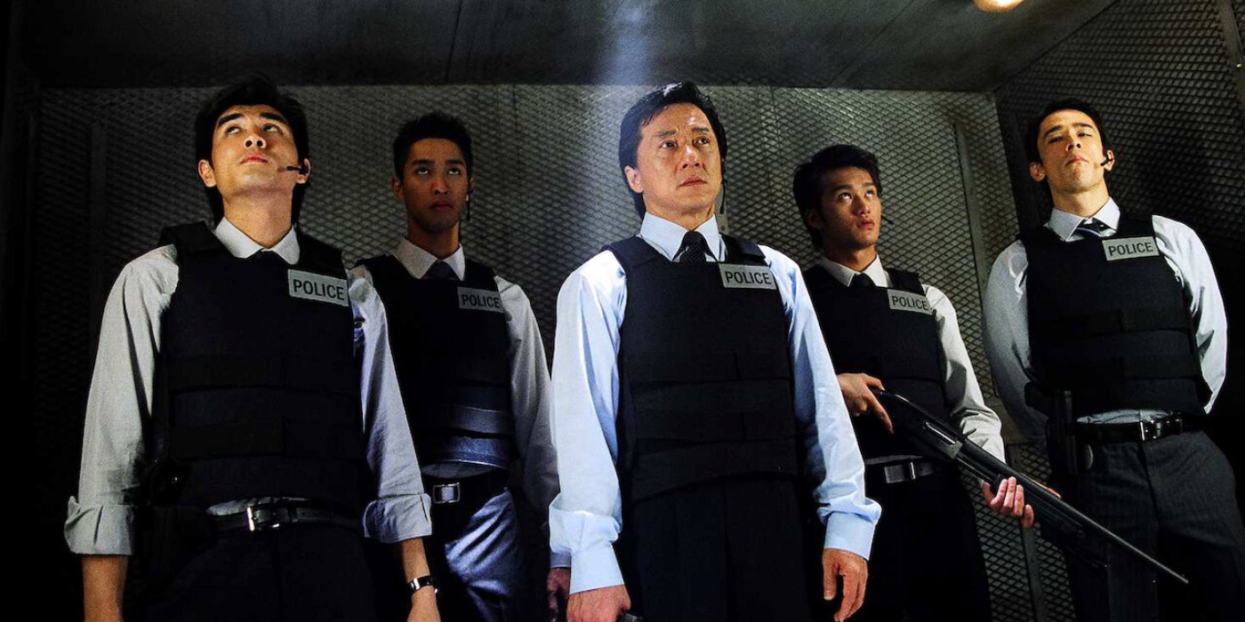 Inspector Chan (Jackie Chan) leads his squad in an elevator in New Police Story