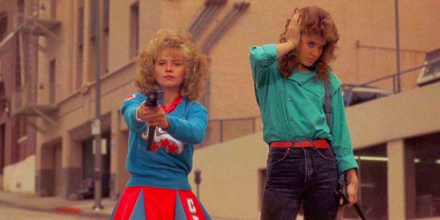 Sam (Kelly Maroney) shoots a gun next to Reggie (Catherine Mary Stewart) in &lsquo;Night of the Comet&rsquo;