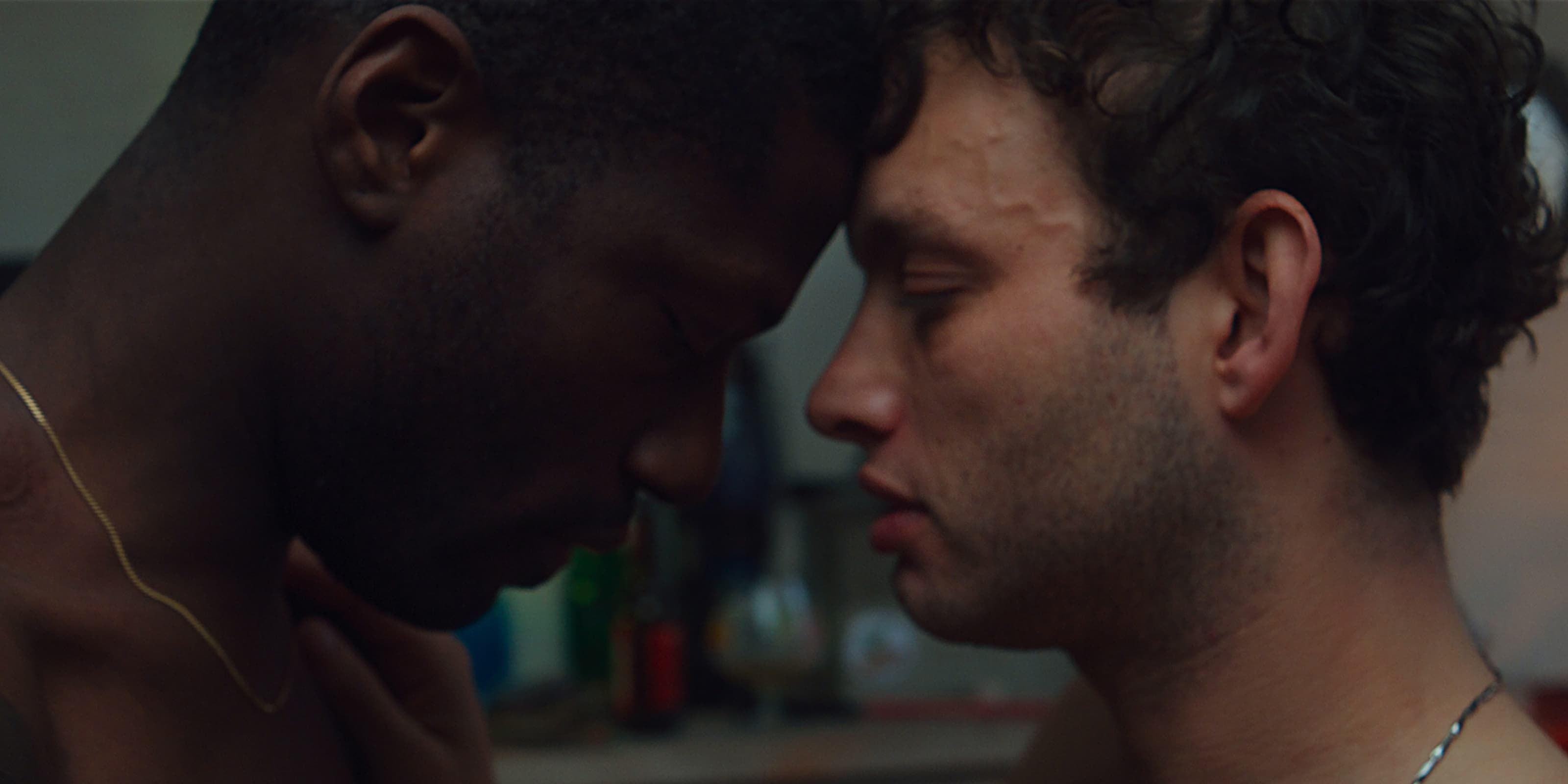 Night and Pablo, played by actors Erwan Kepoa Falé and Théo Cholbi stand shirtless facing each other in Eat The Night.