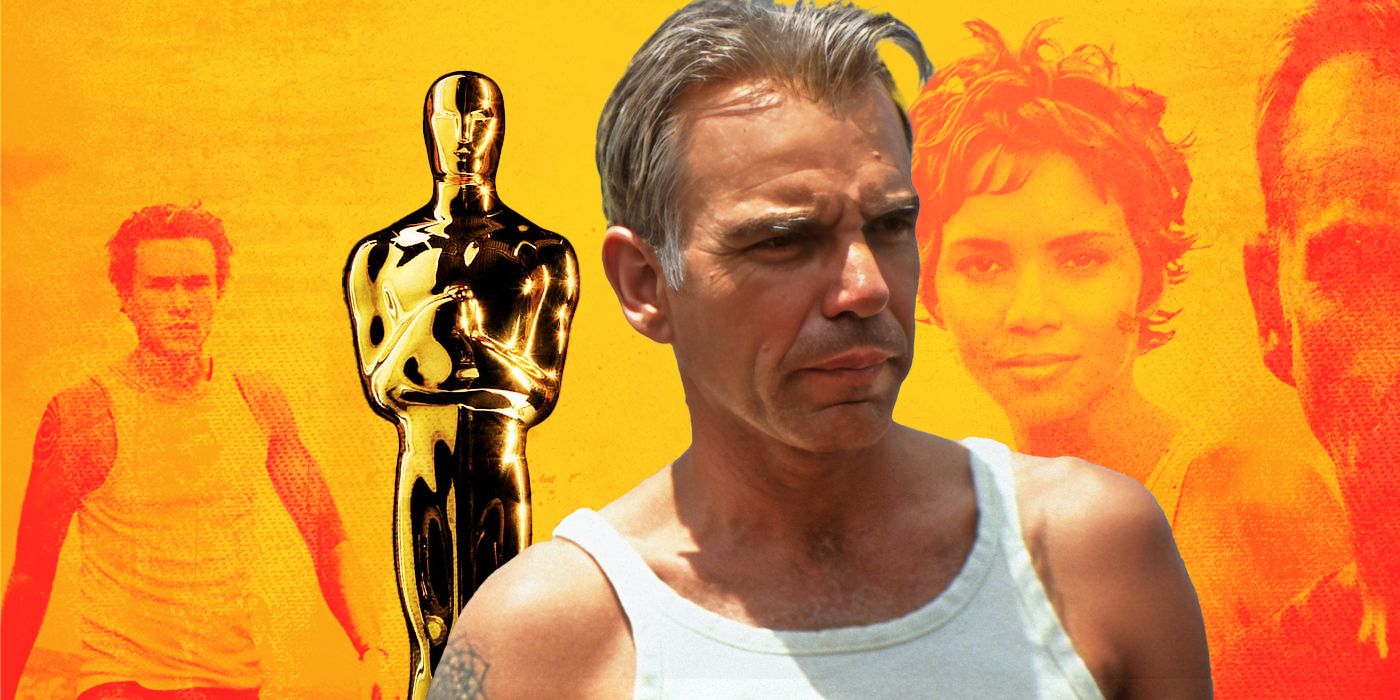 Actor Billy Bob Thornton standing in a white vest, in front of an Oscar statuette and a yellow-tinted poster for the film Monster's Ball.