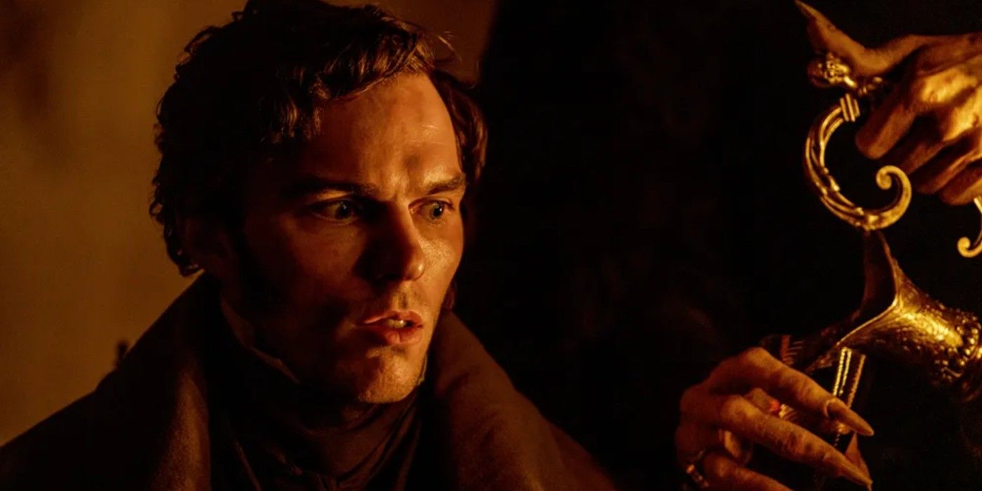 Nicholas Hoult as Thomas Hutter is approached from behind by Count Orlok in 'Nosferatu'