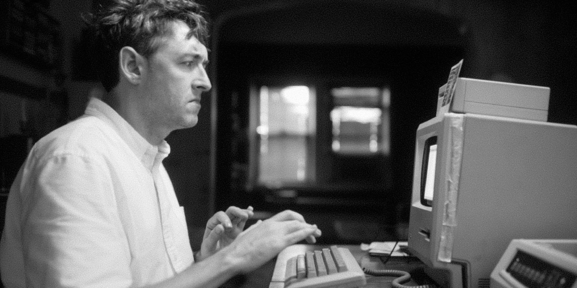 Albert Birney as Conor typing on his computer in OBEX