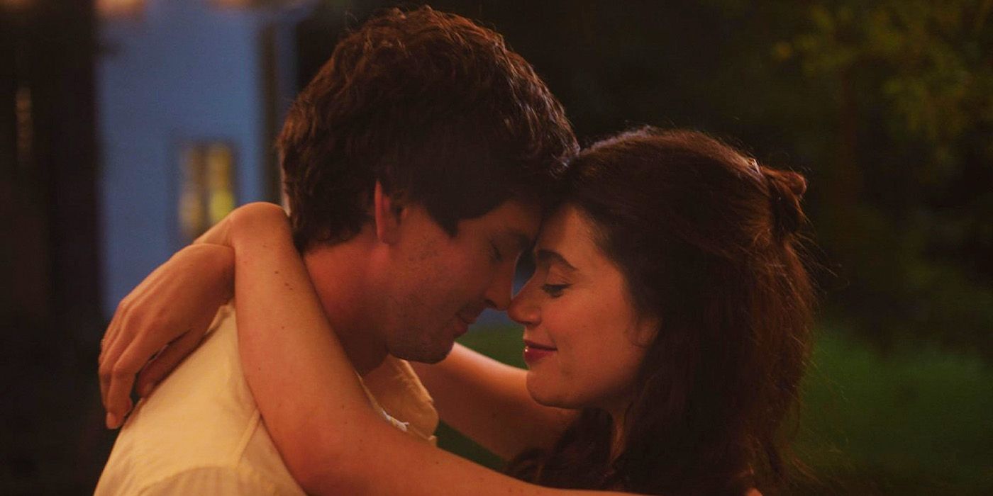 Close-up of Isaac (Logan Lerman) and Iris (Molly Gordon) dancing in Oh, Hi!