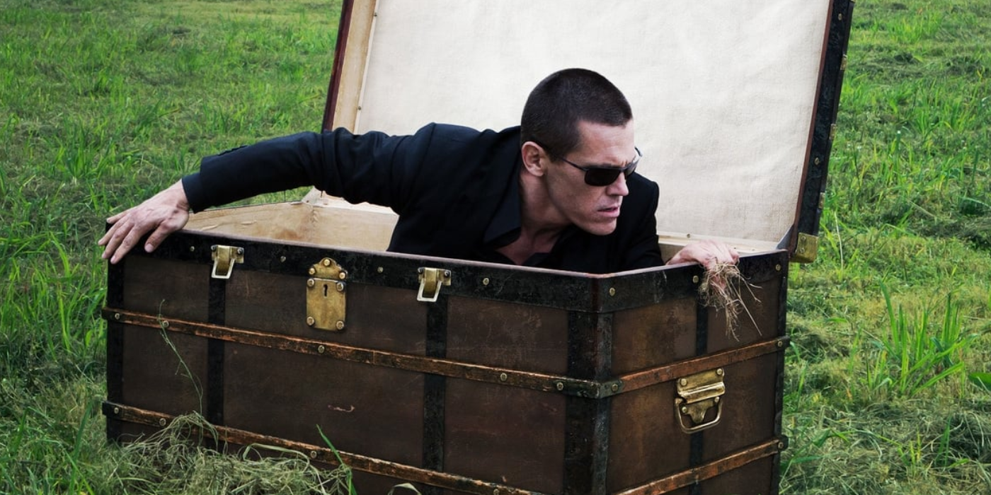 Josh Brolin emerges from a chest in Oldboy (2013)