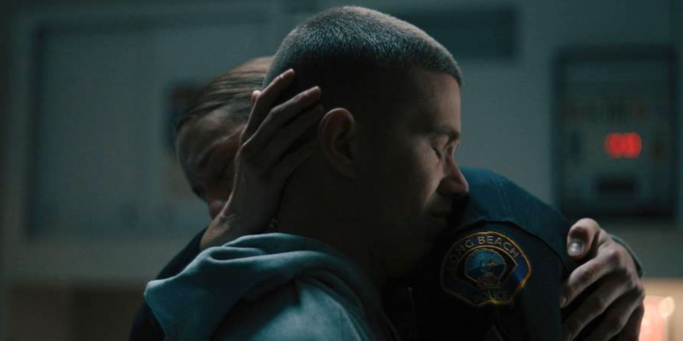 Troian Bellisario as Harmon hugging Brandon Larracuente as Diaz with her right hand on his head in On Call