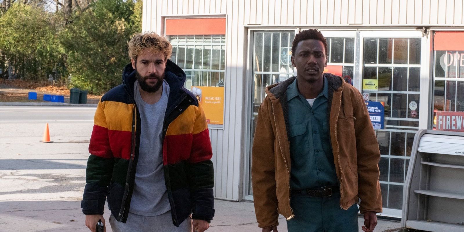 Christopher Abbott and Jerrod Carmichael walk next to each other out of a gas station in 'On the Count of Three'