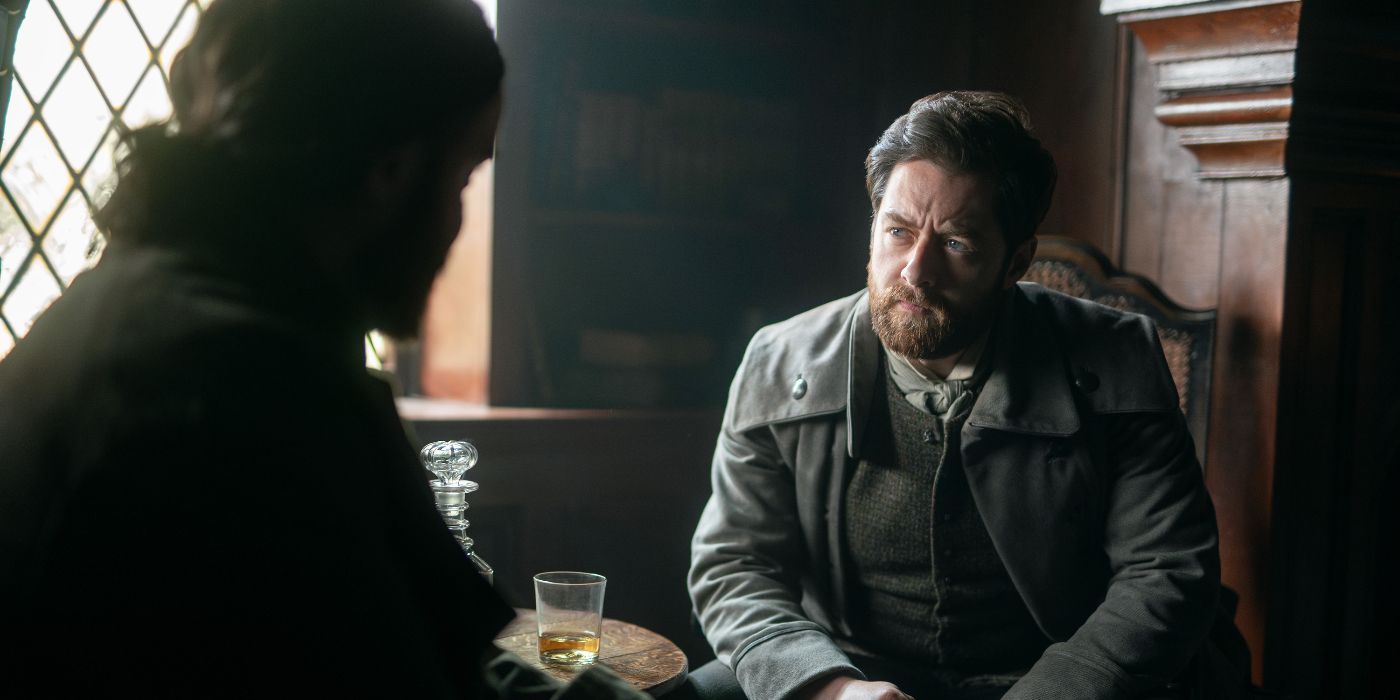 Richard Rankin sitting at a table listening intently