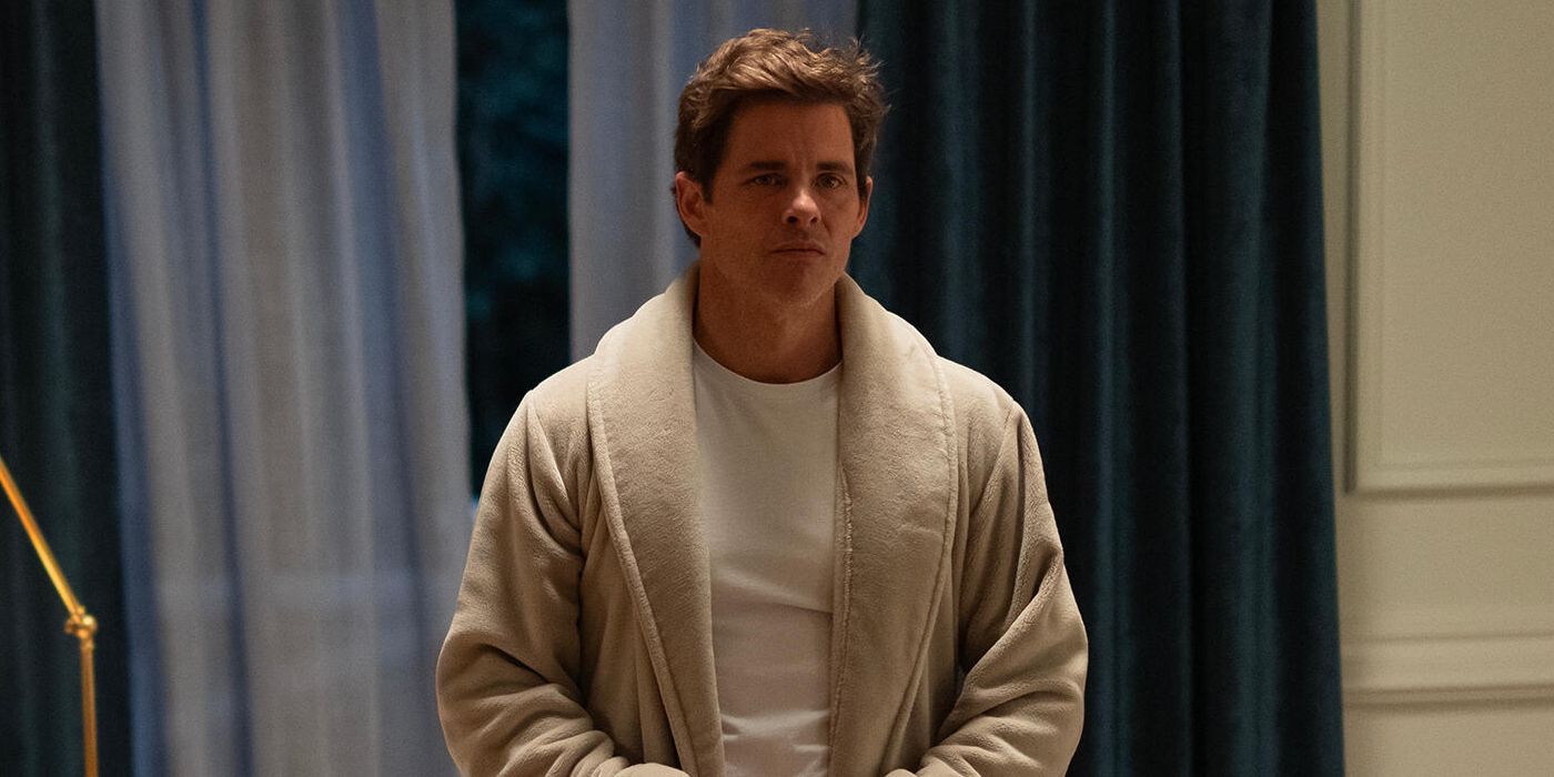 James Marsden as Cal Bradford standing in a t-shirt and robe in the Hulu series Paradise