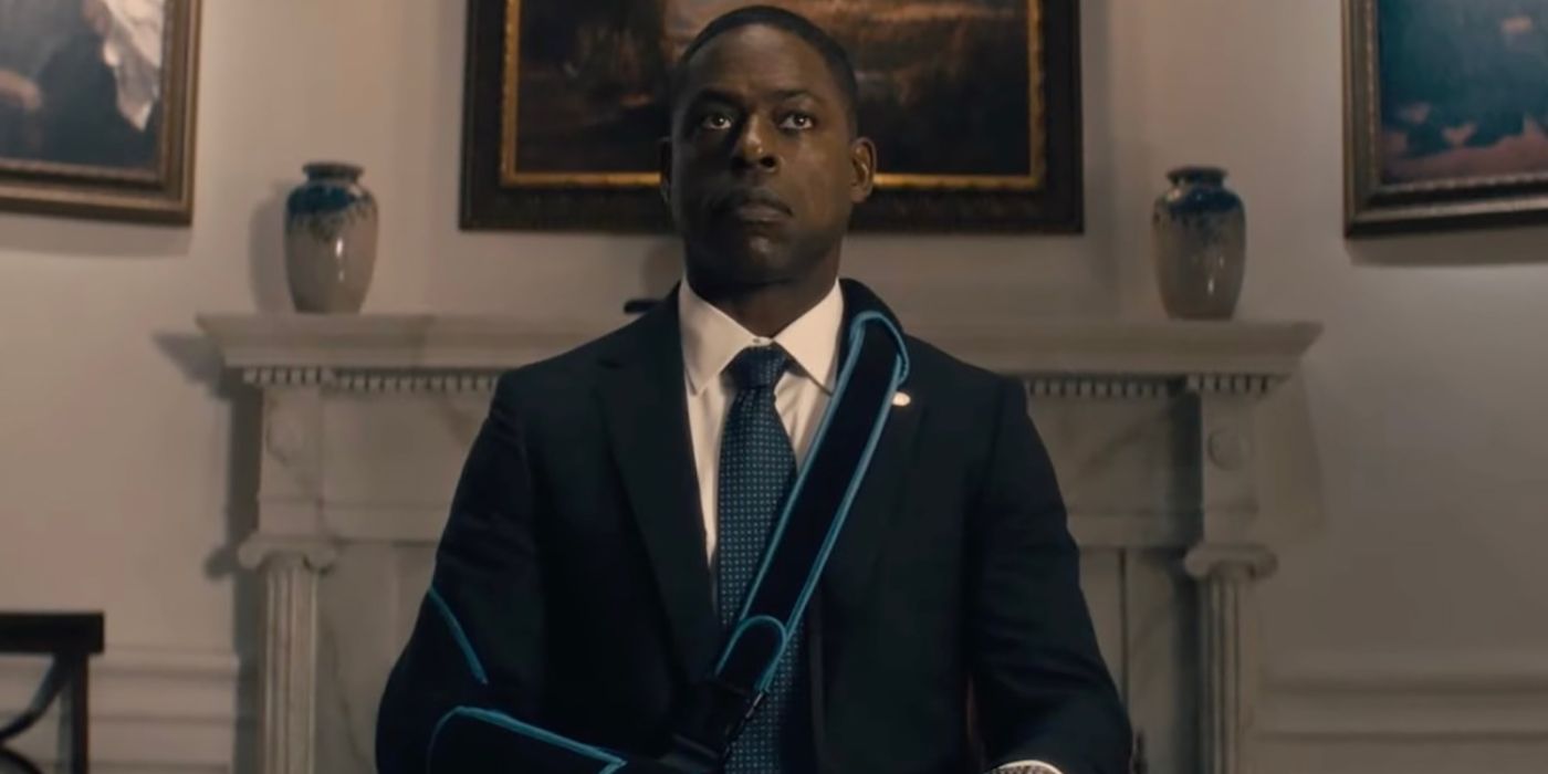 Sterling K. Brown sitting in a chair looking up with a serious face in Paradise.