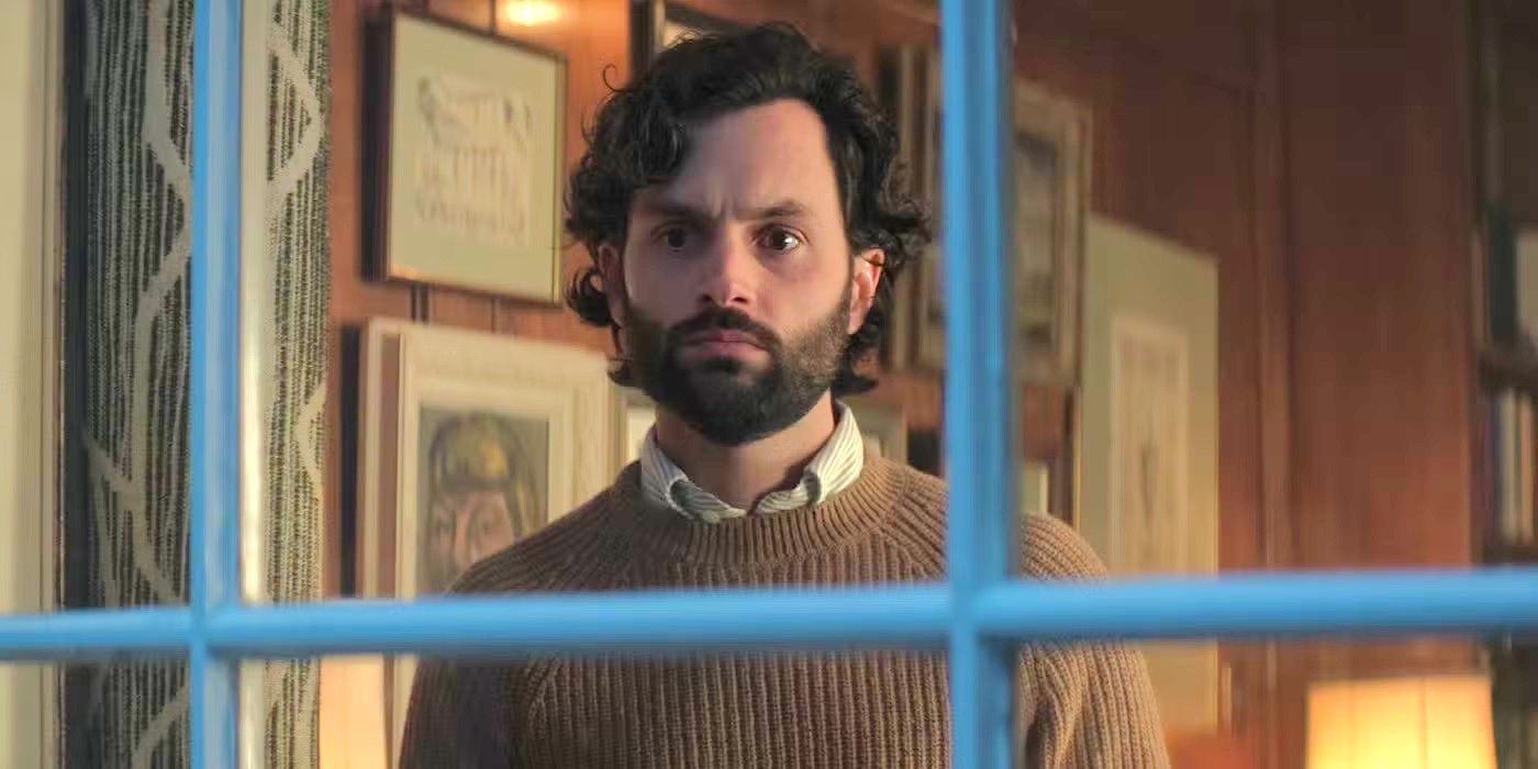 Penn Badgley as Joe Goldberg looking out his apartment window in &lsquo;You&rsquo; Season 4.