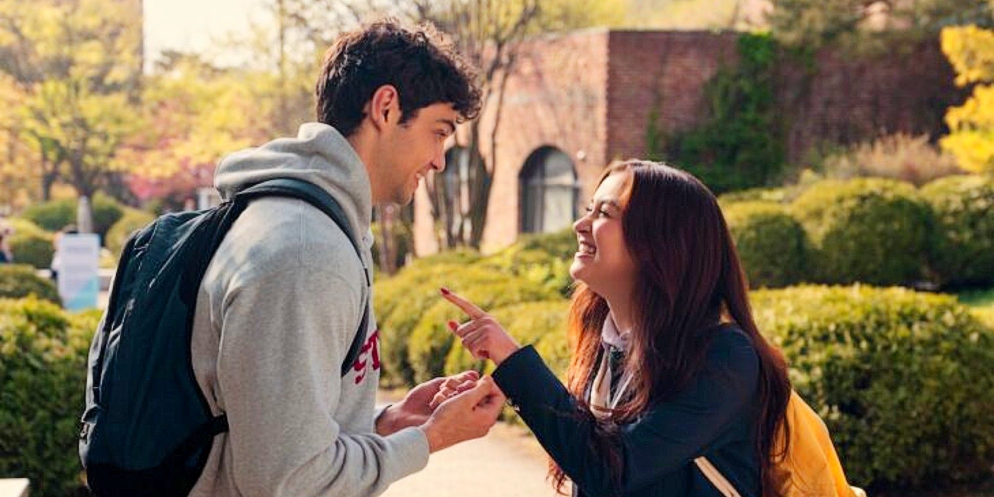 Peter Kavinsky and Kitty Song Covey laughing while having a conversation in XO, Kitty Season 2