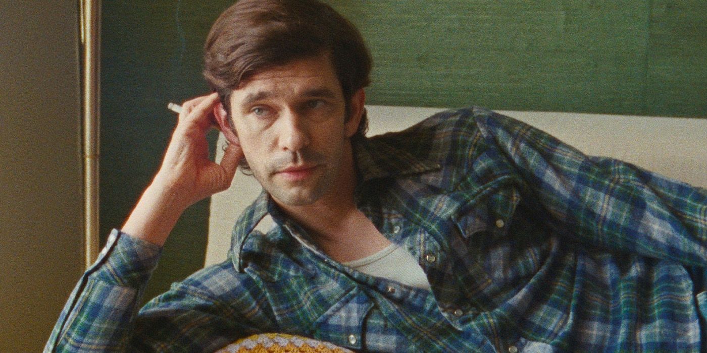 Peter (Ben Whishaw) lying on a couch smoking a cigarette in Peter Hujar's Day