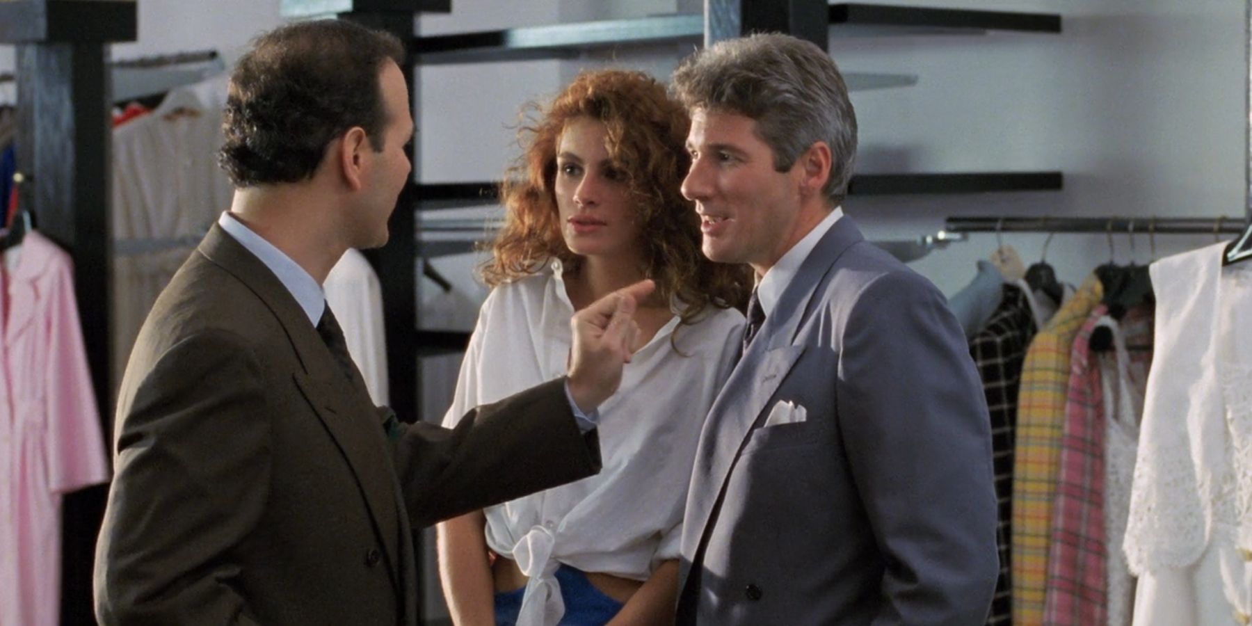 Vivian (Julia Roberts) and Edward (Richard Gere) talk to a clothing store employee in &lsquo;Pretty Woman&rsquo;.
