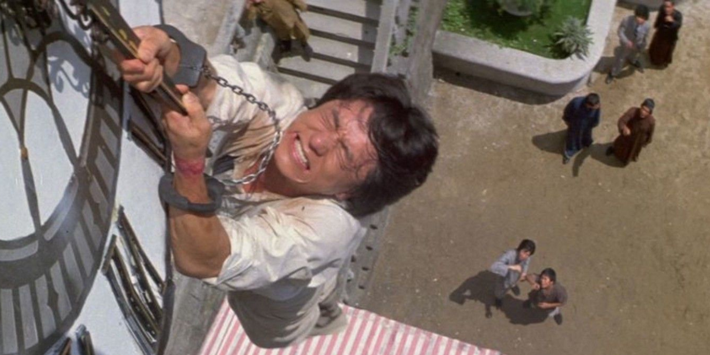 Handcuffed Jackie Chan hangs from a clock tower in Project A