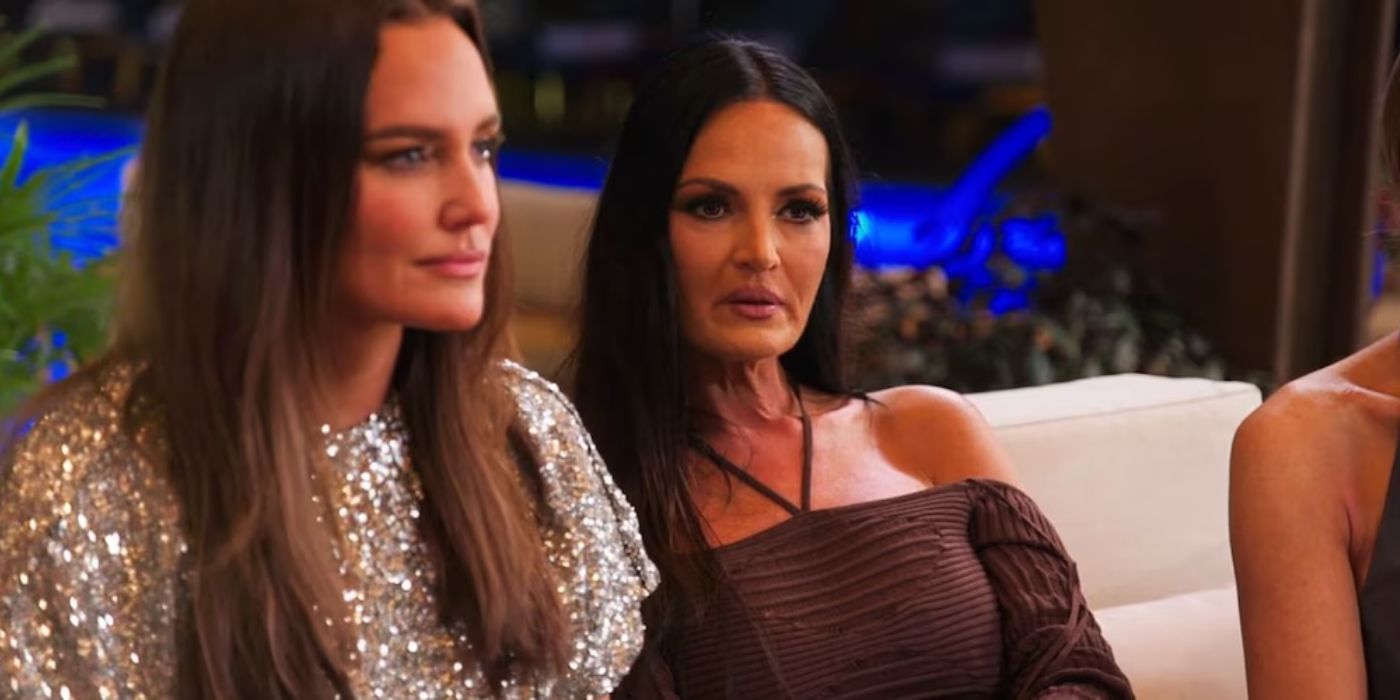 Meredith Marks and Lisa Barlow sit on the couch on 'The Real Housewives of Salt Lake City.'