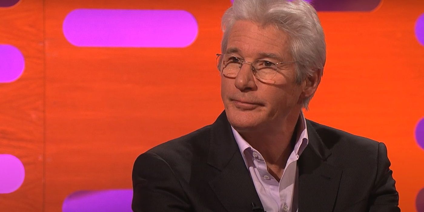 Richard Gere sits on the couch with a blank look on his face on 'The Graham Norton Show'.