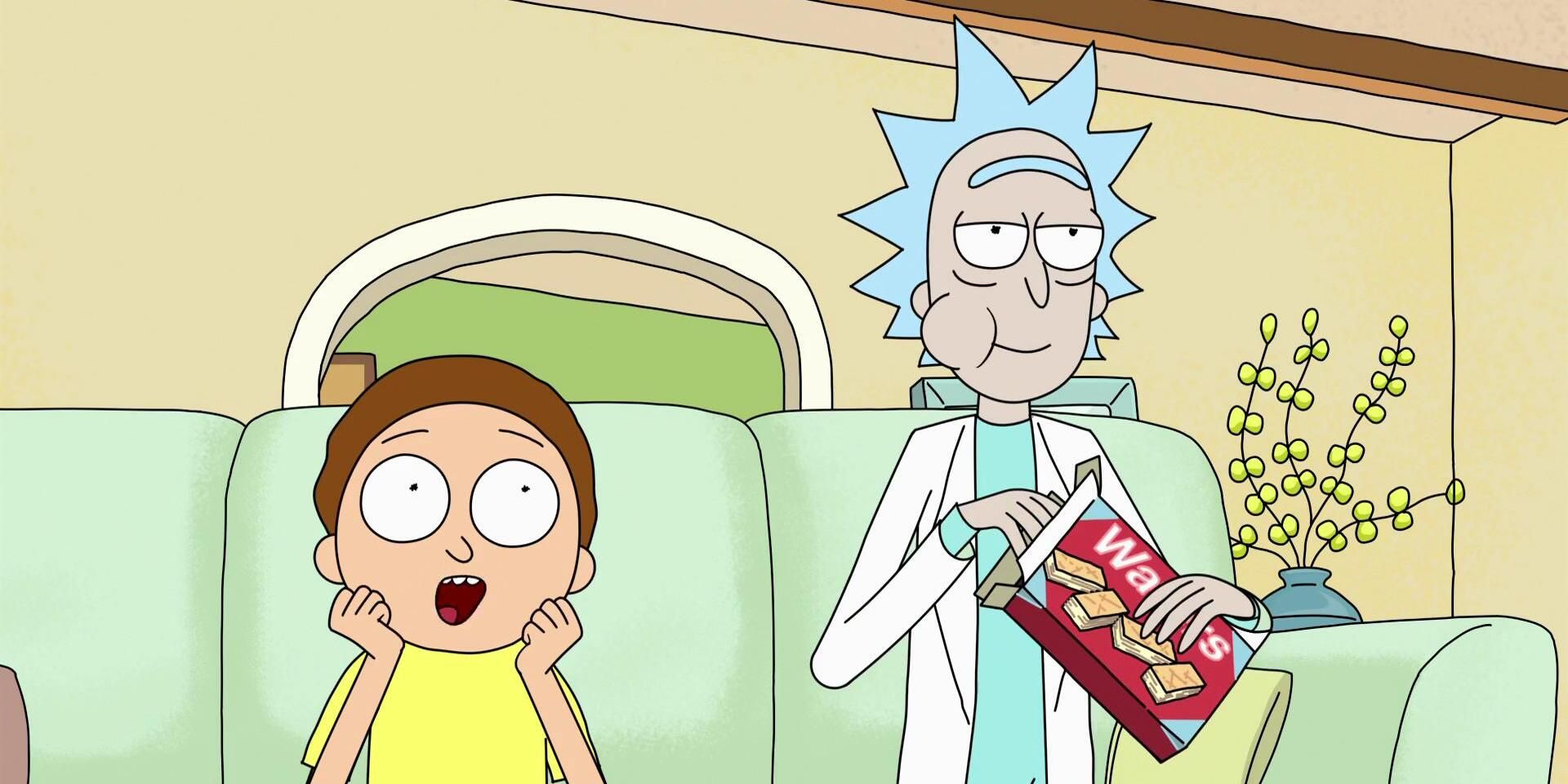 Rick Sanchez eating from a box of wafers while sitting on the couch watching interdimensional cable with Morty in the Rick and Morty episode 'Rixty Minutes'