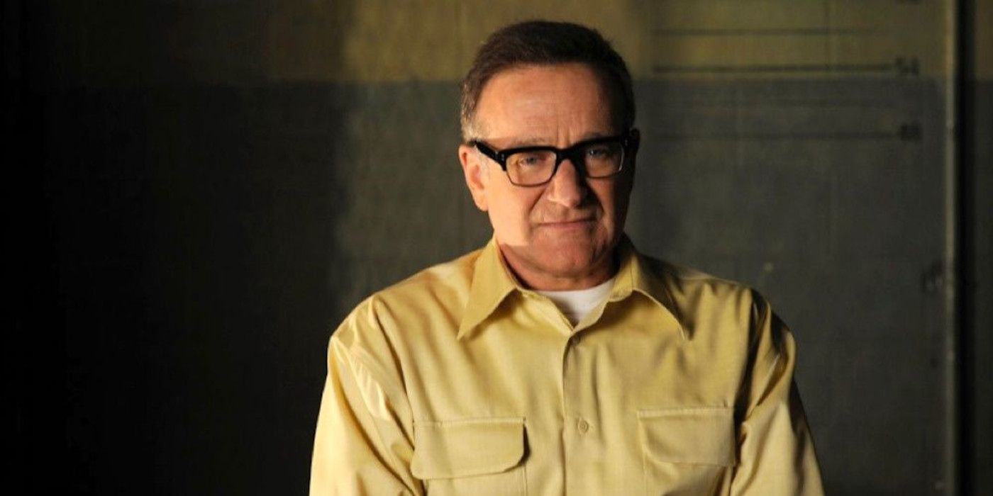 Robin Williams as Merritt Rook sits in a holding cell, deep in thought on Law &amp; Order: SVU.