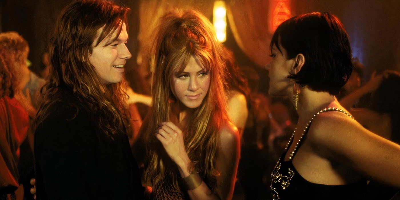 Mark Wahlberg and Jennifer Aniston speak to Dagmara Domińczyk at a party in 'Rock Star' (2001)