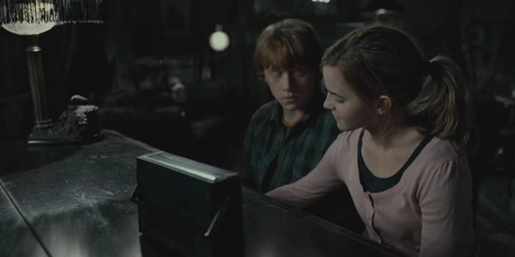 Ron looking at Hermione in Deathly Hallows Part 1 as she plays the piano
