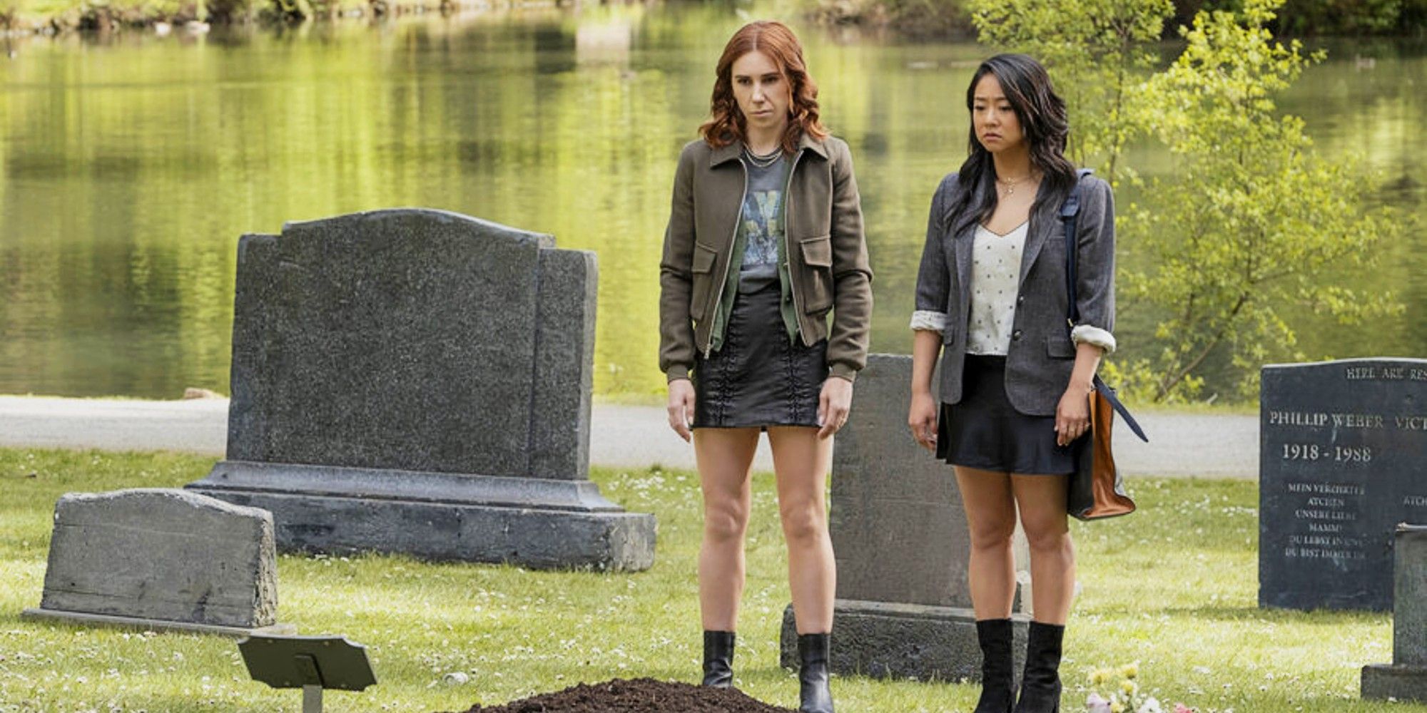 AJ and Ruby standing in a cemetery in Laid Season 1.