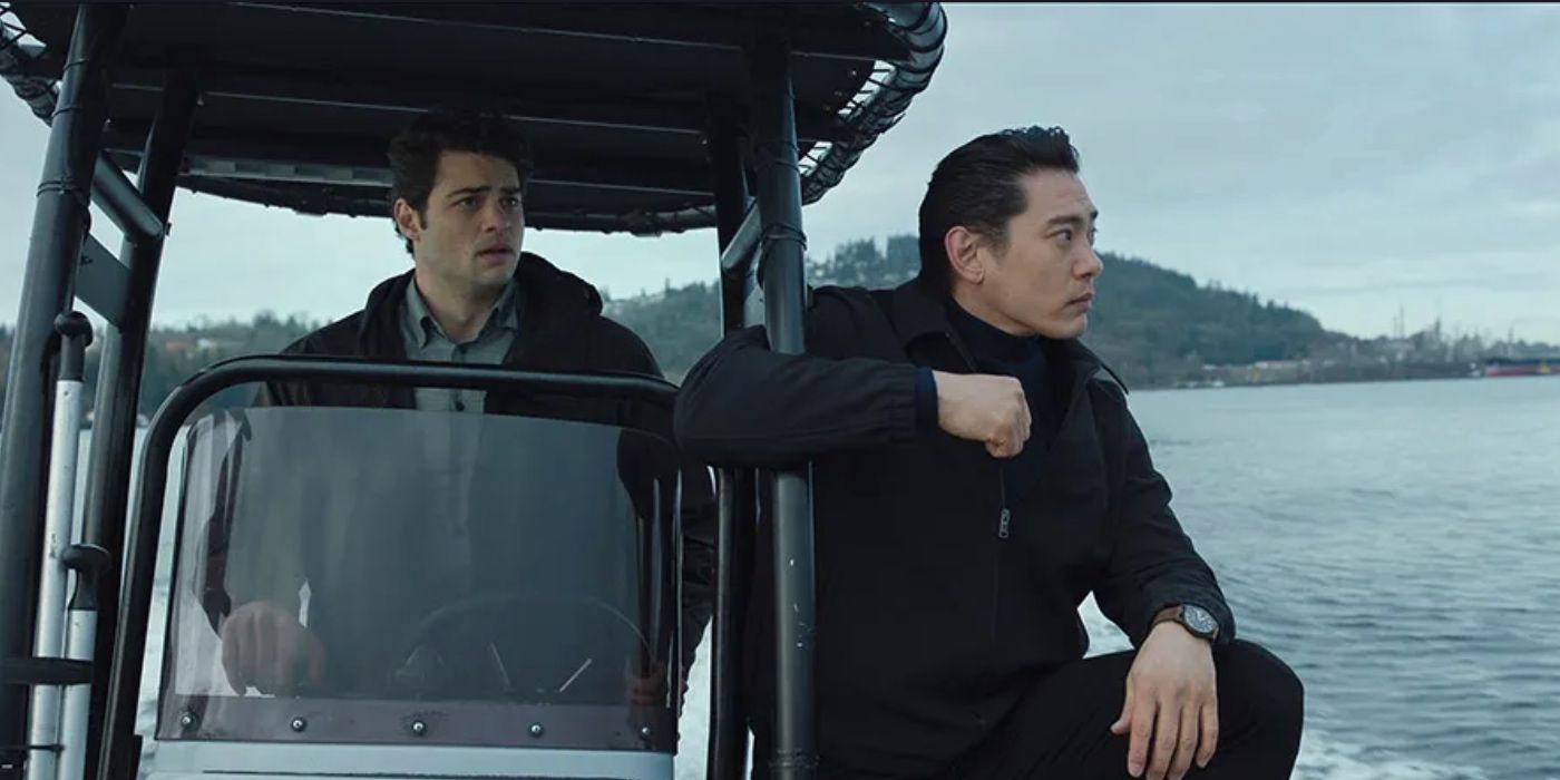 Noah Centineo as Owen driving a boat with Teo Yoo as Jang Kyun at his side in 'The Recruit'