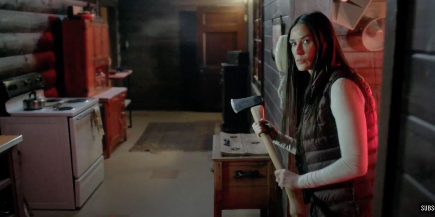 Demi Moore as Claudia holding an axe in 'Empire'