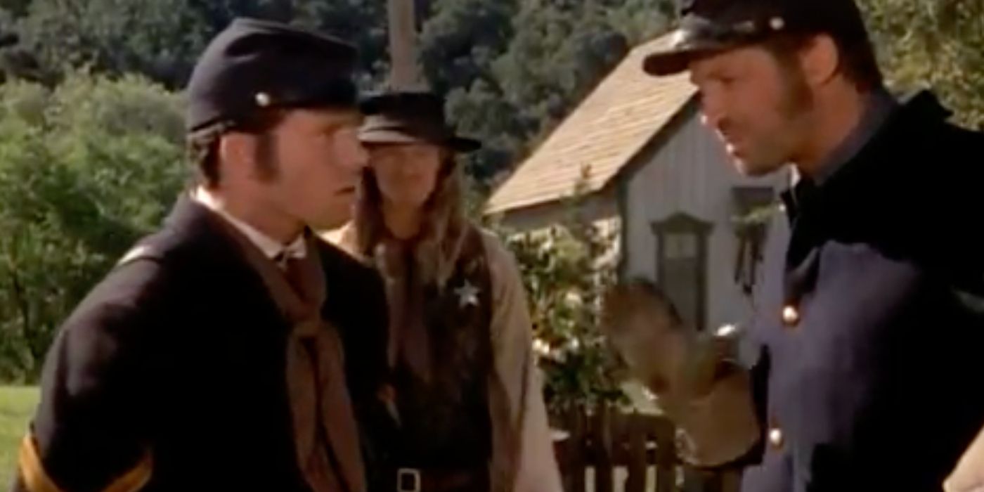 Taylor Sheridan as Cpl. Winters talks to another man in US Army uniforms in Dr. Quinn Medicine Woman.