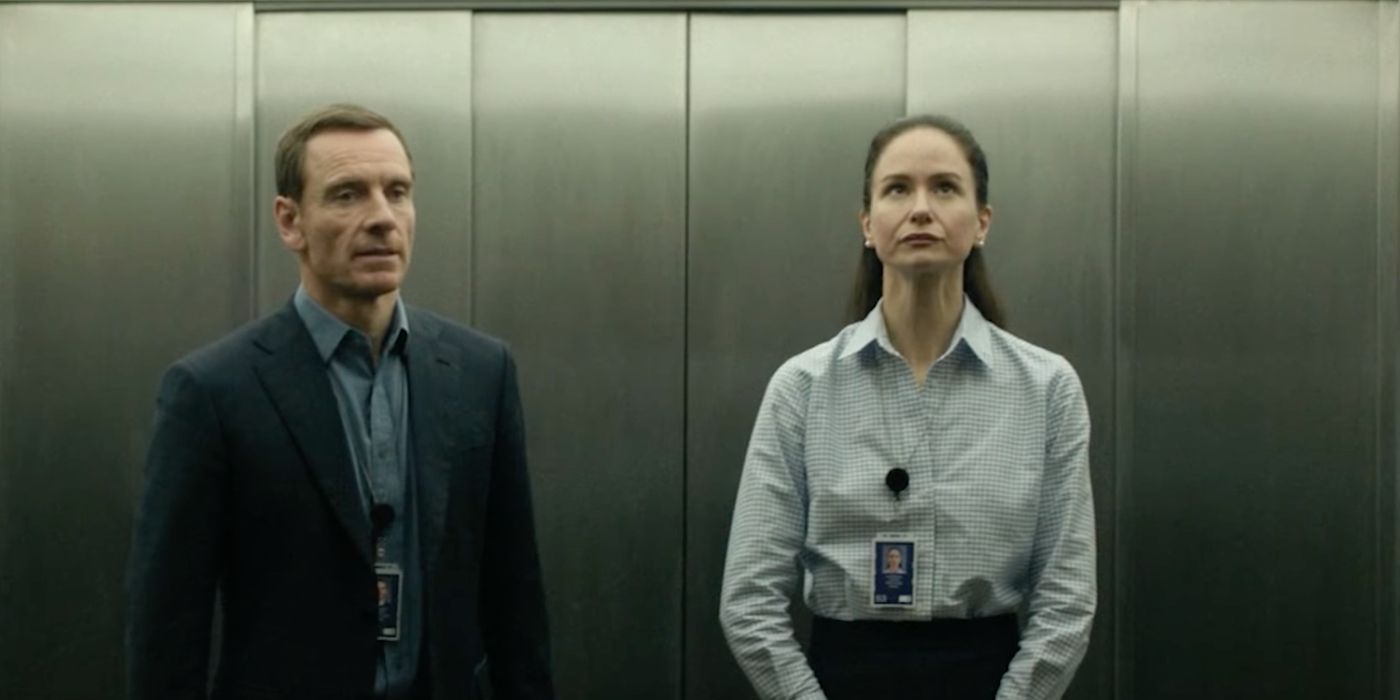 Michael Fassbender as Martian and Katherine Waterston as Naomi in the elevator in 'The Agency'
