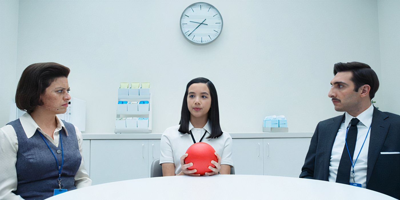 Miss Huang (Sarah Bock) mediates an icebreaker with a red ball between two temporary employees in Apple TV&rsquo;s &lsquo;Severance&rsquo;.