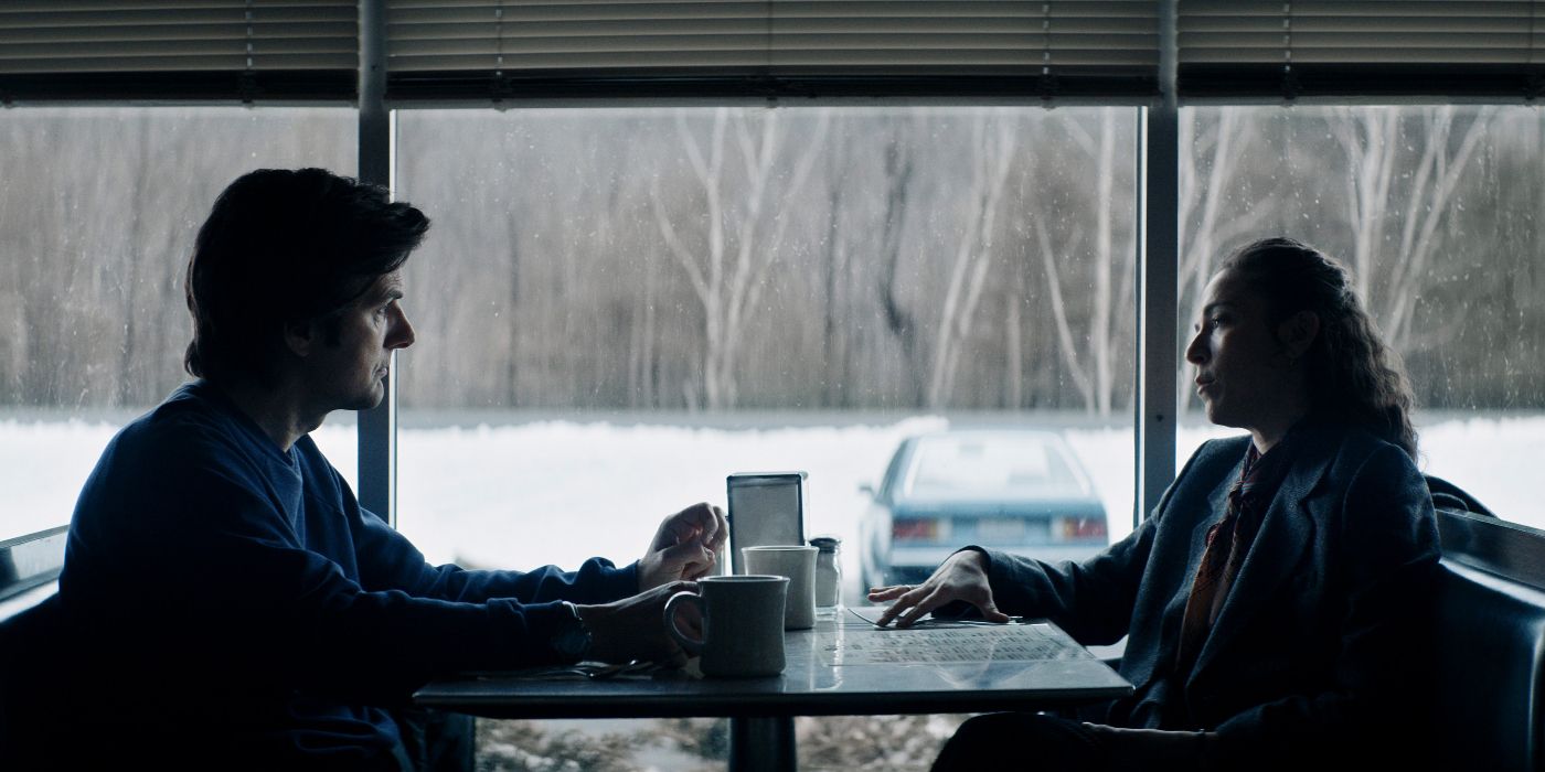 Adam Scott and Jen Tullock sitting at a diner