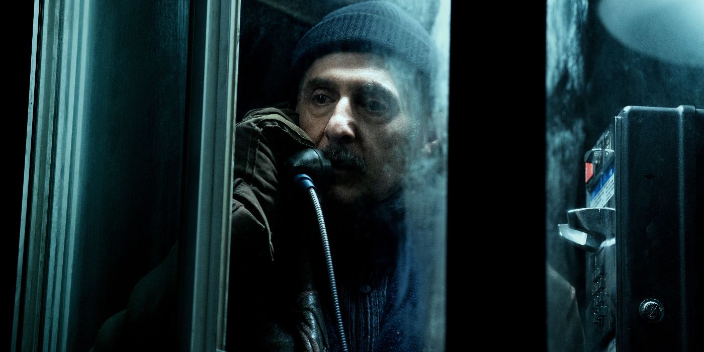 John Turturro using a payphone