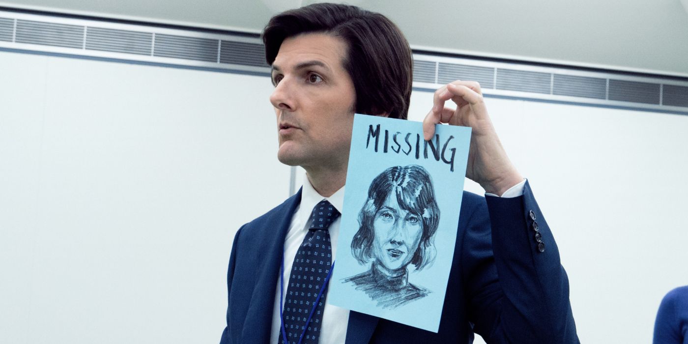 Adam Scott as Mark holding up a missing-person flier with Dichen Lachman's face on it in 'Severance' season 2 episode 3