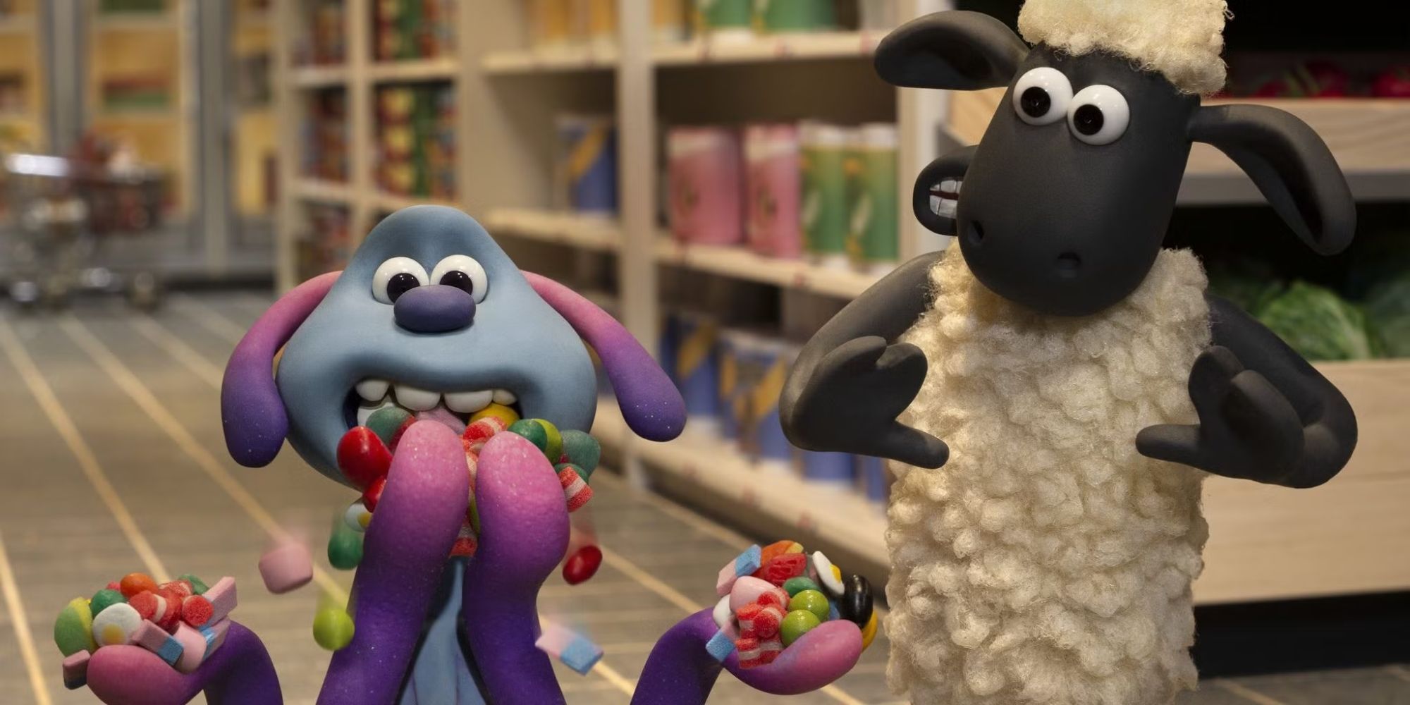 Shaun looks at Lu-La who is eating mouthfuls of candy in a store in A Shaun The Sheep Movie Farmageddon.