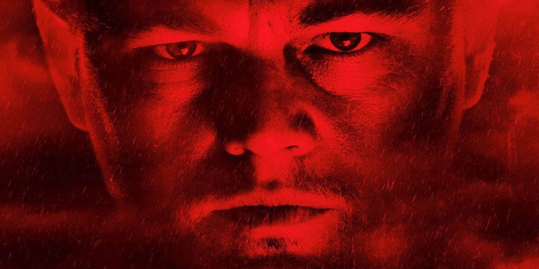 Leonardo DiCaprio as Teddy Daniels, lit in red with rain streaming across his face on the poster for Shutter Island.
