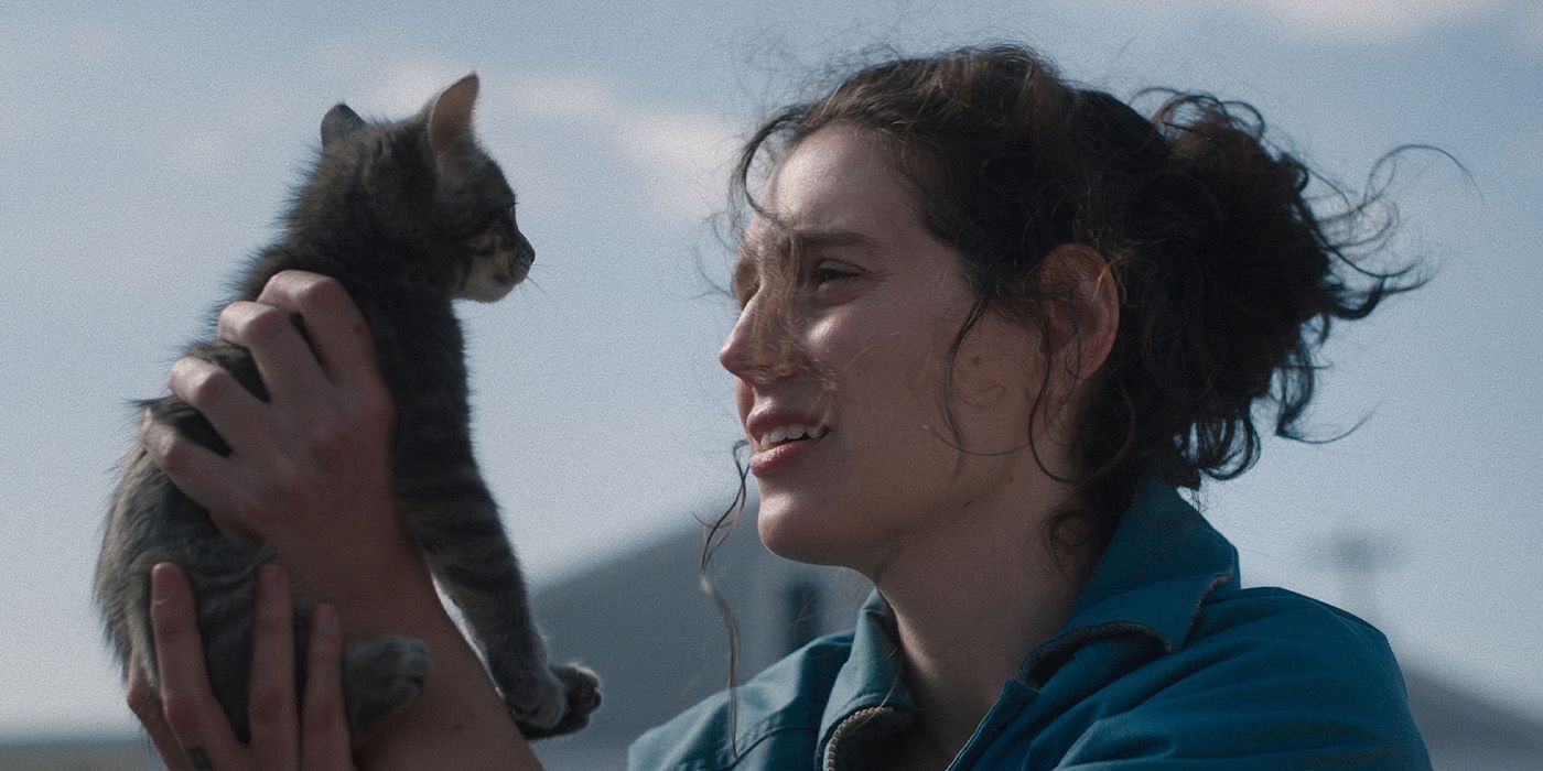 Agnes (Eva Victor) holding up a kitten in Sorry, Baby