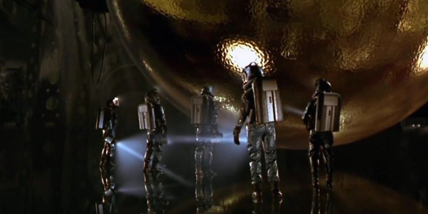 A pivotal moment in &lsquo;Sphere,&rsquo; where the scientists approach the titular sphere.