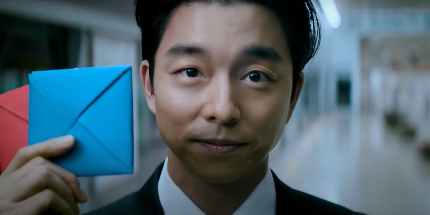 The Salesman (Gong Yoo) offers a game of Ddakji in Squid Game Season 2