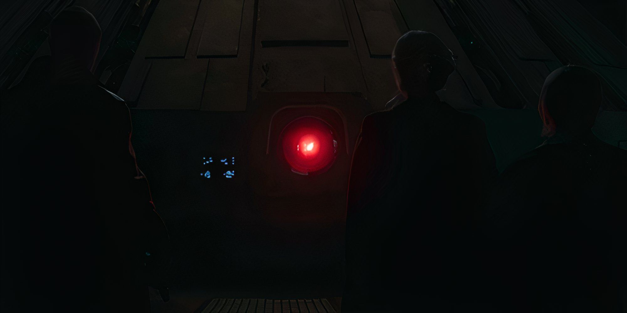 Jod, Fara, and Fern stand in front of the Supervisor's illuminated red eye in?Star Wars: Skeleton Crew